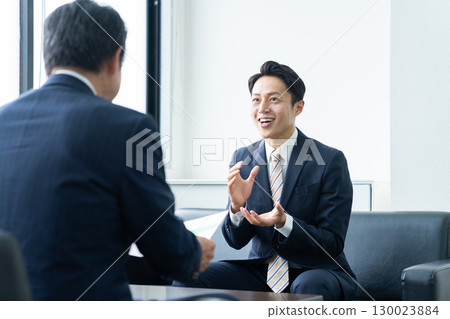 Middle-aged businessman working in the office Middle-aged businessman working in the office 130023884