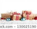 Christmas gift boxes and decor in snow. Isolated on white background 130025190