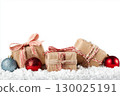 Christmas gift boxes and decor in snow. Isolated on white background 130025191
