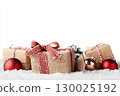 Christmas gift boxes and decor in snow. Isolated on white background 130025192