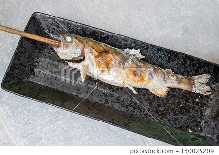Grilled trout skewers; Salt-grilled stream fish cooked over charcoal. Grilled trout skewers; Salt-grilled stream fish cooked over charcoal. 130025209