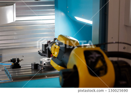 CNC machine automation with robotic arm 130025690