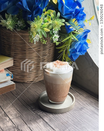 Delicious Cappuccino with Perfect Foam and Cocoa Dusting in a Minimalist White Cup 130026048