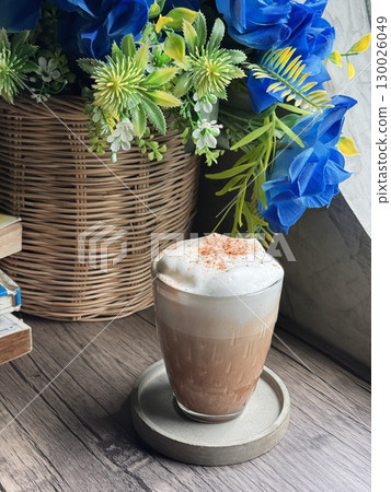 Delicious Cappuccino with Perfect Foam and Cocoa Dusting in a Minimalist White Cup 130026049