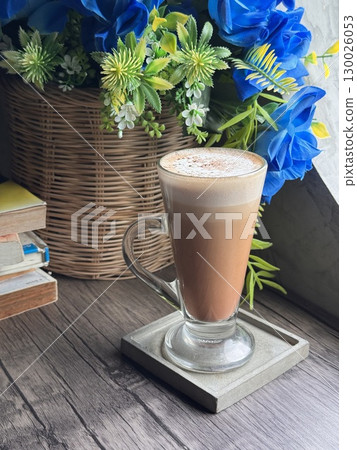 Delicious Cappuccino with Perfect Foam and Cocoa Dusting in a Minimalist White Cup Delicious Cappuccino with Perfect Foam and Cocoa Dusting in a Minimalist White Cup 130026053