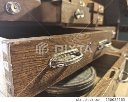 Wooden drawers with vintage handles showcase timeless craftsmanship and design 130026363