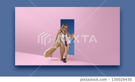 Creative collage of stylish woman in coat and tie stepping through surreal doorway in pastel pink wall. 130026430