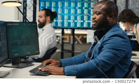 Female colleague bringing documents folders for general manager, assisting the team leader with stack of archived files. Secretary ensuring efficient organizational workflow. Camera B. Female colleague bringing documents folders for general manager, assisting the team leader with stack of archived files. Secretary ensuring efficient organizational workflow. Camera B. 130027274