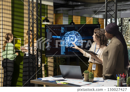 Powerful diverse team leveraging deep learning with big data algorithms, optimizing company performance with AI software and neural networks systems. Business solutions for growth. Powerful diverse team leveraging deep learning with big data algorithms, optimizing company performance with AI software and neural networks systems. Business solutions for growth. 130027427