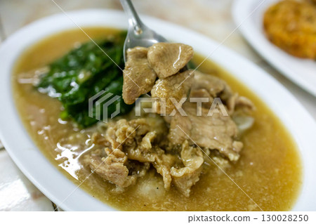 Top view of Stir Fried Wide Rice Noodle with Egg in Gravy Sauce, focus selective 130028250