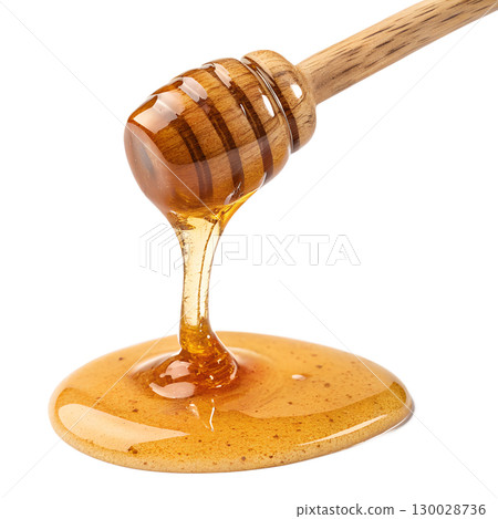 Golden honey pouring smoothly from a wooden dipper isolated on transparent background 130028736