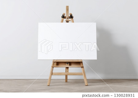 Blank white canvas on an easel on a wooden stand, a mock-up on a neutral background. Empty space for text or design. Web banner. Landscape artist easel painter, stand, frame. Sign Painting Mockup 130028931