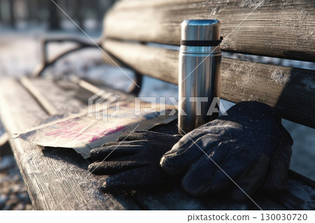 Abandoned Thermos and Gloves on Frosty Park Bench in Winter Abandoned Thermos and Gloves on Frosty Park Bench in Winter 130030720