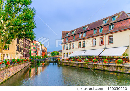 The Petite France Quarter, quay des Moulins embankment of River Ill canal with weirs, medieval buildings in old town Strasbourg city historic Centre Grand Island, Alsace Grand Est region, France The Petite France Quarter, quay des Moulins embankment of River Ill canal with weirs, medieval buildings in old town Strasbourg city historic Centre Grand Island, Alsace Grand Est region, France 130030920