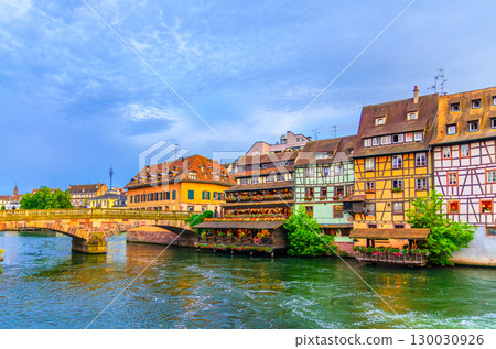 Strasbourg city historic centre, The Petite France Quarter with buildings colorful houses and Pont Saint-Martin bridge across River Ill canal in old town Centre, Alsace Grand Est region, France 130030926