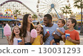 Family enjoying the theme park 130031293