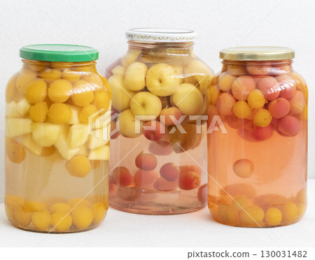 Canned compote in jars of various fruits and berries. Food Canned compote in jars of various fruits and berries. Food 130031482