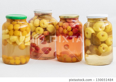 Canned compote in jars of various fruits and berries. Food Canned compote in jars of various fruits and berries. Food 130031484