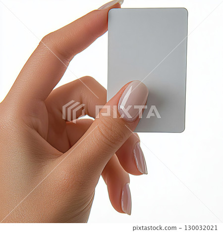 Hand holding a blank card with elegant nails against a light background Hand holding a blank card with elegant nails against a light background 130032021