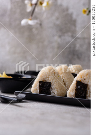 Onigiri, traditional japanese dish with rice 130033253