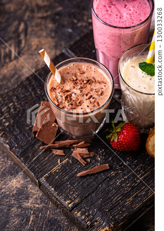 Milkshake from strawberry, banana and chocolate 130033268