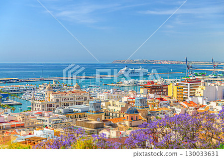 Aerial panoramic view of old town Alicante, panorama of Alicante city historic centre, centro Alacant, Port of Alicante with cruise ship in Bahia de Alicante bay of Mediterranean Sea horizon, Spain 130033631