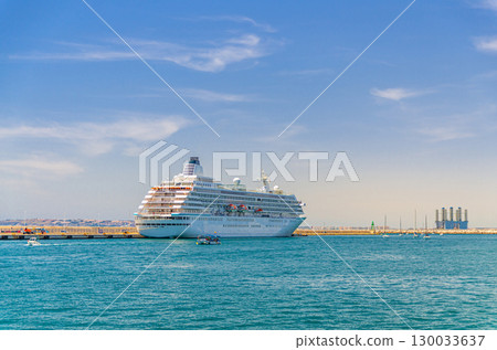 Grand cruise ship moored near pier in harbor Port of Alicante Puerto de Alicante, white cruise ship voyage in Mediterranean Sea water Alicante bay, concept travel on holiday, vacation summer, Spain Grand cruise ship moored near pier in harbor Port of Alicante Puerto de Alicante, white cruise ship voyage in Mediterranean Sea water Alicante bay, concept travel on holiday, vacation summer, Spain 130033637