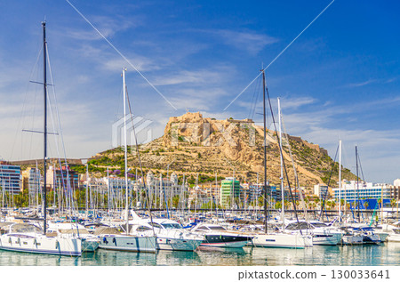 Alicante city historical centre, Port of Alicante Puerto de Alicante marina harbor with yachts and boats, Castillo de Santa Barbara Castle on Mount Benacantil, Alicante bay Mediterranean Sea, Spain Alicante city historical centre, Port of Alicante Puerto de Alicante marina harbor with yachts and boats, Castillo de Santa Barbara Castle on Mount Benacantil, Alicante bay Mediterranean Sea, Spain 130033641