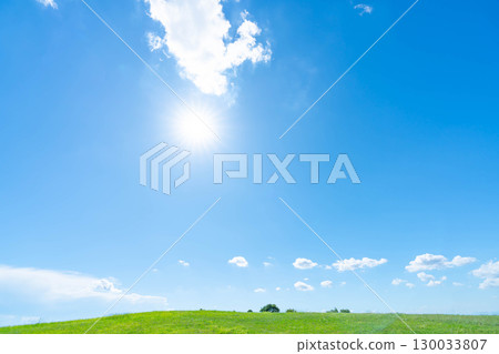 Blue sky, clouds, sun and grassland Blue sky, clouds, sun and grassland 130033807