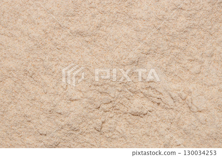 Whole wheat flour texture background for baking Whole wheat flour texture background for baking 130034253