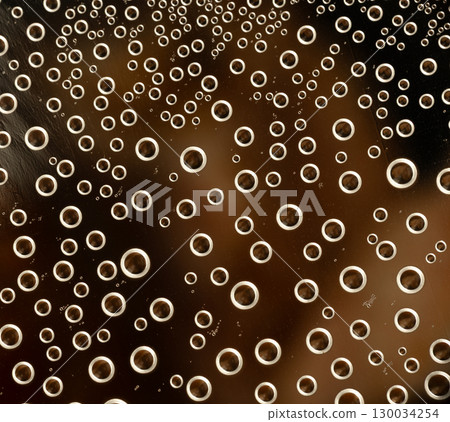 Close-up of bubbles in dark liquid macro background 130034254