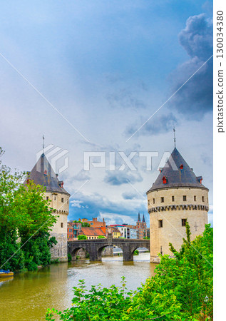 Broeltorens Broel Towers Gothic architecture style stone medieval buildings near Broel Bridge, bank of Lys river in Kortrijk city centre, Fortification towers, vertical view, Flemish Region, Belgium Broeltorens Broel Towers Gothic architecture style stone medieval buildings near Broel Bridge, bank of Lys river in Kortrijk city centre, Fortification towers, vertical view, Flemish Region, Belgium 130034380