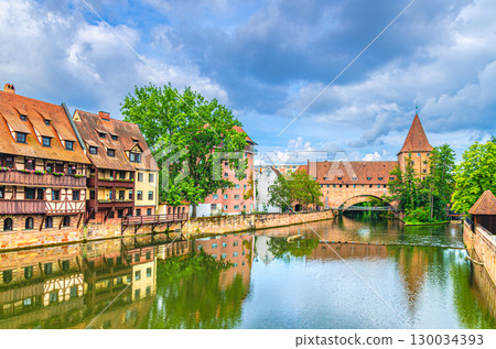 Schlayerturm Schlayer tower medieval building, Chained Suspension Bridge Kettensteg grouser, Pegnitzwehr and Pegnitz river in Old town Nuremberg city historic center, Middle Franconia region, Germany 130034393
