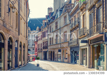 Rue Forges pedestrian street in Dijon city historical centre with stores, shops and old typical houses medieval buildings, Dijon old town in sunny summer day, Bourgogne-Franche-Comte region, France Rue Forges pedestrian street in Dijon city historical centre with stores, shops and old typical houses medieval buildings, Dijon old town in sunny summer day, Bourgogne-Franche-Comte region, France 130034399