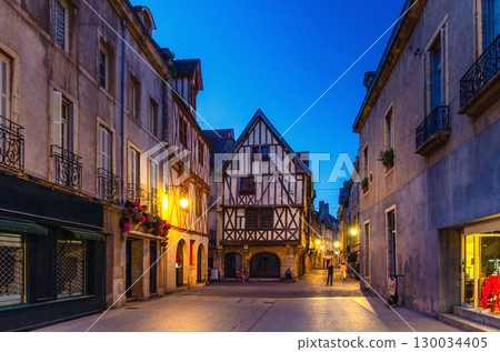 Old medieval houses buildings on Rue Verrerie pedestrian street in Dijon city historical centre, Dijon old town centre ville on twilight dusk evening view, Bourgogne-Franche-Comte region, France Old medieval houses buildings on Rue Verrerie pedestrian street in Dijon city historical centre, Dijon old town centre ville on twilight dusk evening view, Bourgogne-Franche-Comte region, France 130034405