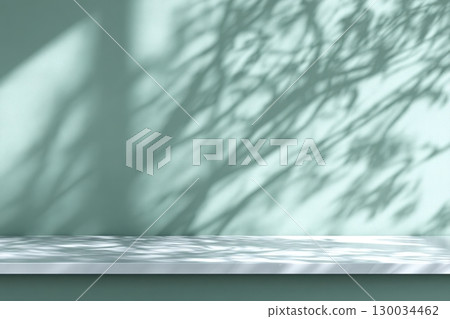 Minimal abstract background. Tree leaves light and shadows. Cosmetic product presentation. Premium podium. Pastel soft mint wall, white table. Showcase display case. Front view. Mockup ad. Green wall 130034462