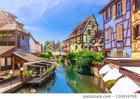 Little Venice la Petite Venise in old town Colmar city historic centre with old colorful houses medieval buildings on bank of river Lauch canal in summer day, Alsace Grand Est region, France Little Venice la Petite Venise in old town Colmar city historic centre with old colorful houses medieval buildings on bank of river Lauch canal in summer day, Alsace Grand Est region, France 130034708