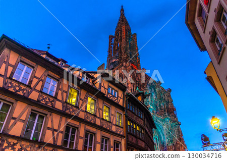 Cathedral of Our Lady of Strasbourg Minster Cathedrale Notre-Dame Roman catholic church and houses medieval buildings in old town Strasbourg city historic Centre, Evening view, Alsace region, France Cathedral of Our Lady of Strasbourg Minster Cathedrale Notre-Dame Roman catholic church and houses medieval buildings in old town Strasbourg city historic Centre, Evening view, Alsace region, France 130034716