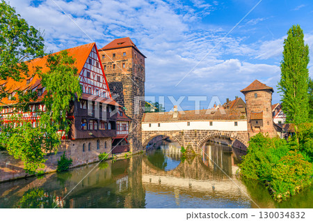 Henkerhaus Executioner's House Museum, Weinstadel Former Wine Depot medieval building, Wasserturm Water tower and Executioner Bridge across Pegnitz river in Old town Nuremberg city center, Germany 130034832
