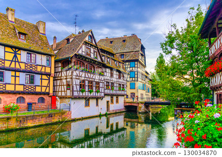 The Petite France Quarter Quartier des Tanneurs, houses medieval buildings and Pont du Faisan bridge across River Ill canal in old town Strasbourg city historic Centre Ville, Alsace region, France 130034870