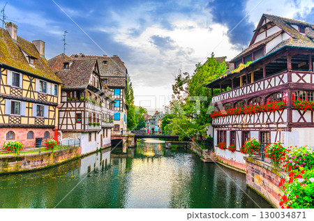 The Petite France Quarter, old houses medieval buildings, Maison des Tanneurs and Faisan bridge across River Ill canal in old town Strasbourg city historic Centre Grand Island, Alsace region, France The Petite France Quarter, old houses medieval buildings, Maison des Tanneurs and Faisan bridge across River Ill canal in old town Strasbourg city historic Centre Grand Island, Alsace region, France 130034871
