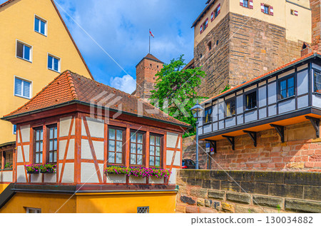 Medieval small half-timbered building near Nuremberg Castle Nurnberger Burg Imperial castle Kaiserburg, Heathens Tower Heidenturm in old town Nuremberg city historical center, Bavaria state, Germany 130034882