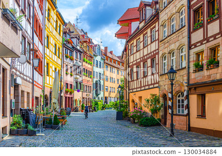 Old town Nuremberg city historical center, pedestrian street Tanner's Lane with old medieval buildings colorful half-timbered houses, Middle Franconia region, Bavaria state, Germany 130034884