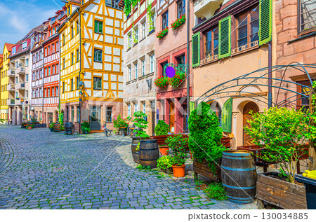 Old town Nuremberg city historical center, pedestrian street Tanner's Lane with old medieval buildings colorful half-timbered houses, Middle Franconia region, Bavaria state, Germany 130034885