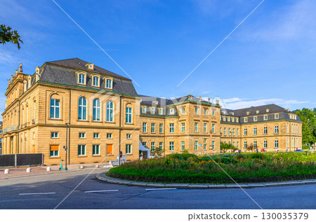 New Palace Neues Schloss Baroque style building lateral wing in old town Stuttgart city historic center with blue sky in sunny summer day, Baden-Wurttemberg state, Germany 130035379