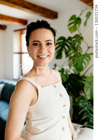 Confident woman taking a break, casual home portrait. Confident woman taking a break, casual home portrait. 130035734
