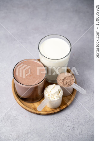 Protein powder and protein drinks, with scoops. Food supplement, bodybuilding, fitness and sport 130035929