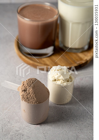 Protein powder and protein drinks, with scoops. Food supplement, bodybuilding, fitness and sport 130035931
