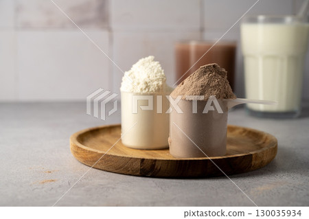 Protein powder and protein drinks, with scoops. Food supplement, bodybuilding, fitness and sport 130035934