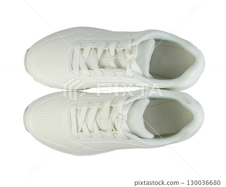 A pair of white sneakers isolated on white background A pair of white sneakers isolated on white background 130036680